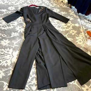 Kay Unger black jumpsuit with overlay jeweled decorations on bodice